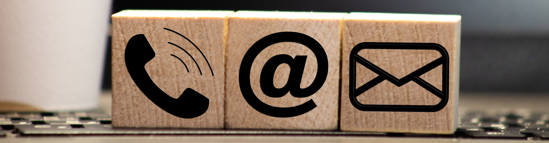 wooden block of contact icons